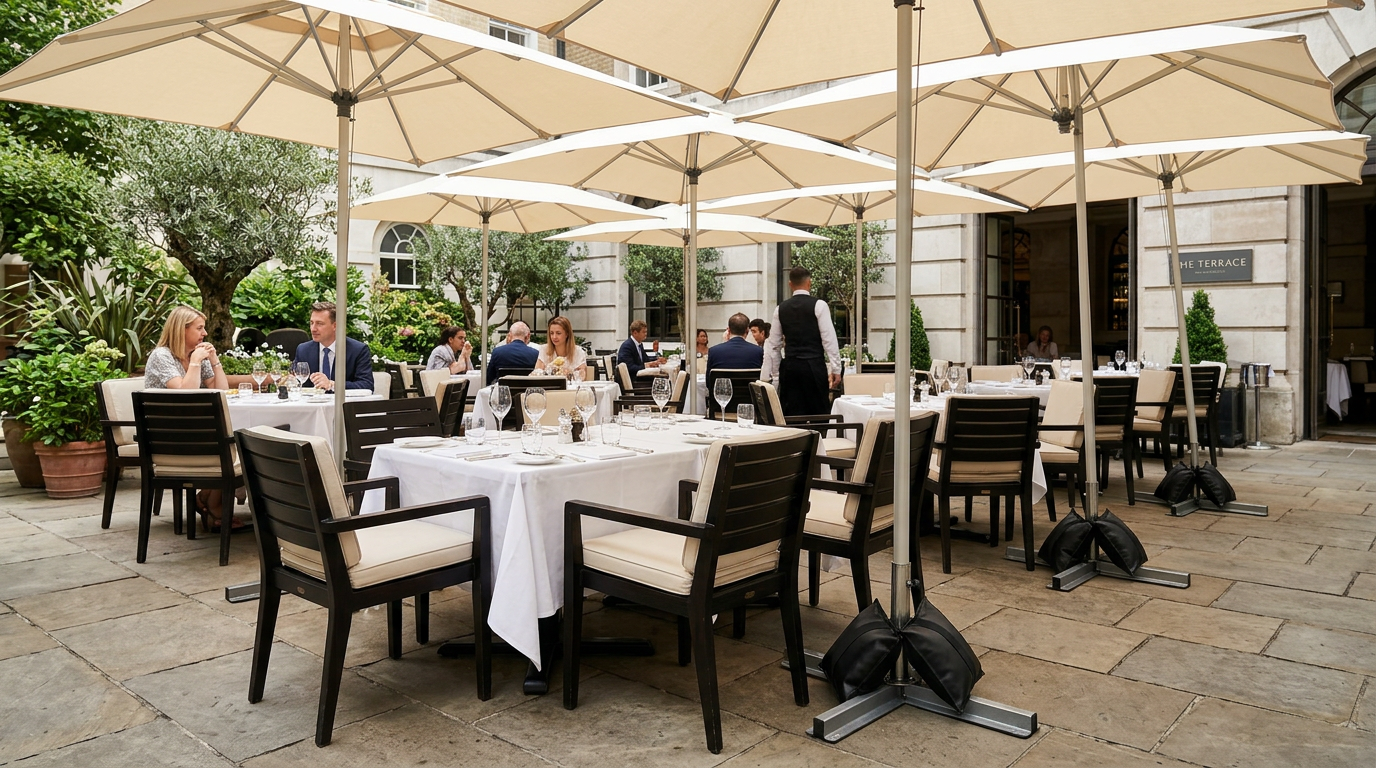 Shot bags stabilising outdoor restaurant umbrellas to prevent movement in windy conditions